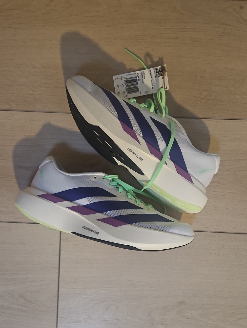 adidas White Running Shoes with Purple Stripes and Neon Green Accents